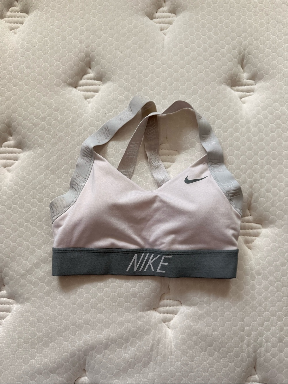 38. Nike Pink and Gray Cross-Back Sports Bra